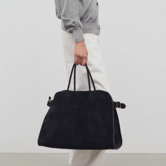 large margaux handbag-black suede purse model holding