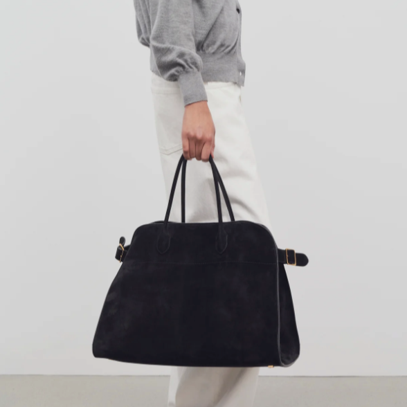 large margaux handbag-black suede purse model holding