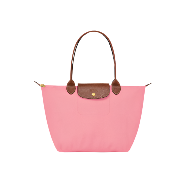 Pink handbag with brown handles and trim on a light gray background-pink purse