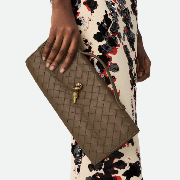 andiamo clutch- pinecone purse model holding