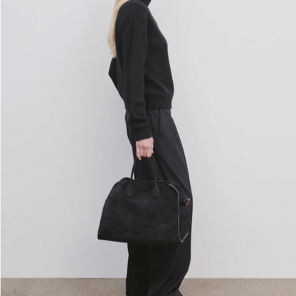 small margaux handbag-black suede purse model holding