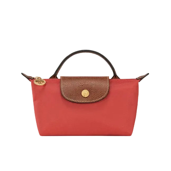 A red mini top-handle handbag with a brown textured leather flap and gold-tone hardware, shown against a light gray background.